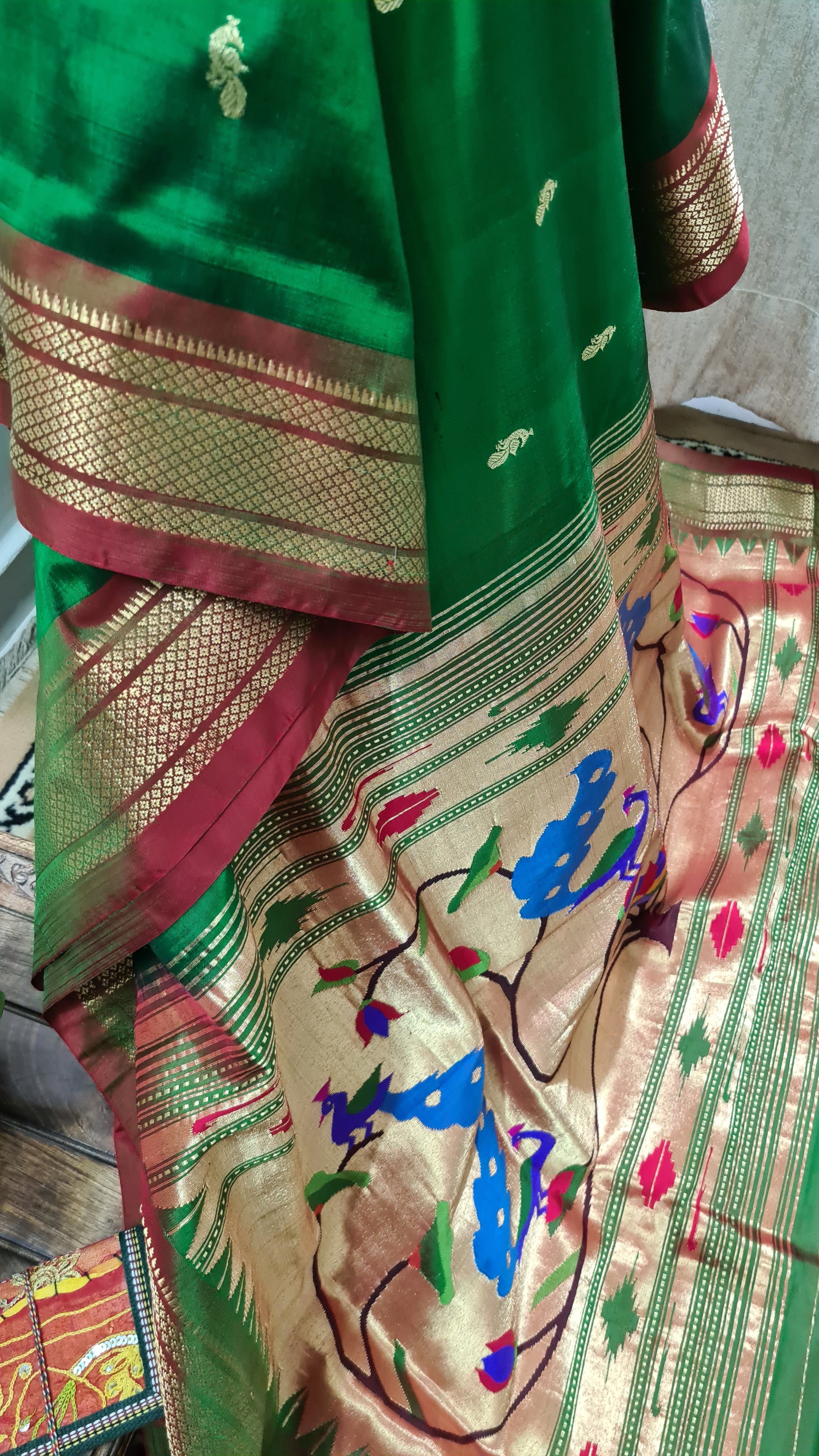 Dark green color paithani silk saree with zari woven work