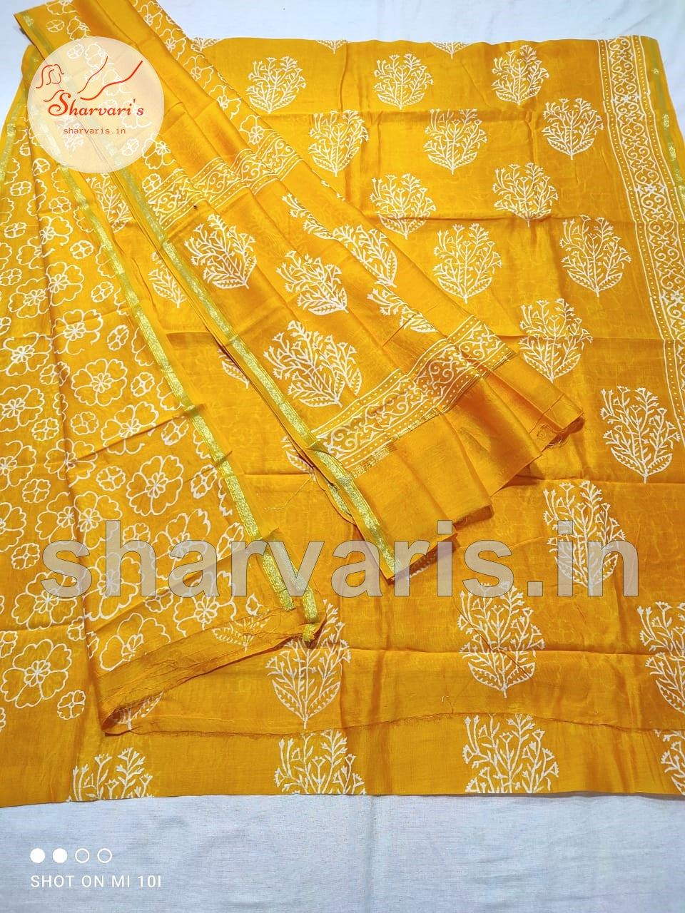 Turmeric Yellow Chanderi Silk Cotton Dress Material with Dabu Prints