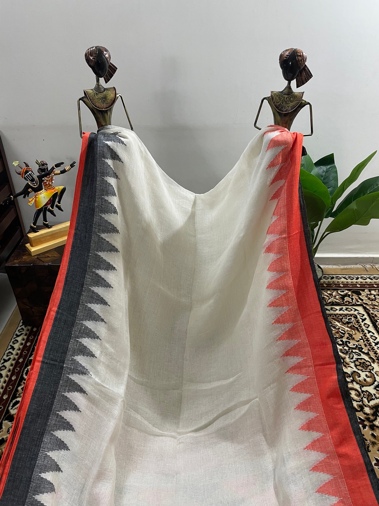 White Jamdani Linen Saree with Orange and Black Ganga Jamuna Borders