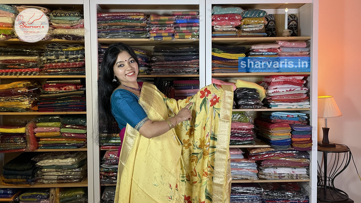 Yellow Moonga Silk Saree with Floral Prints and Zari Borders