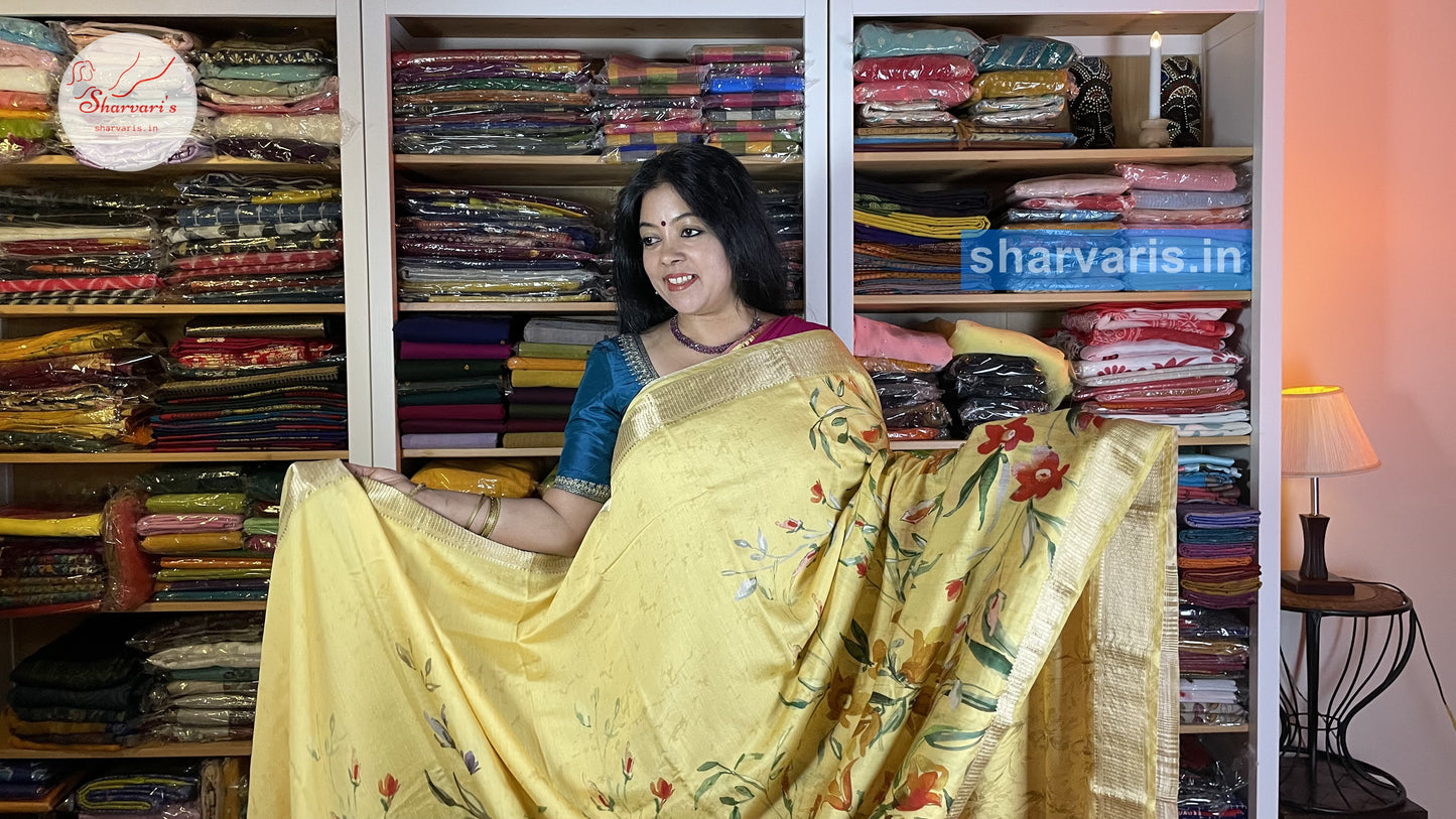 Yellow Moonga Silk Saree with Floral Prints and Zari Borders