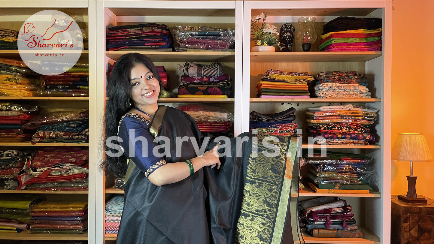 Handwoven Black Semi Raw Silk Saree with Tribal Art Threadwork Patterns