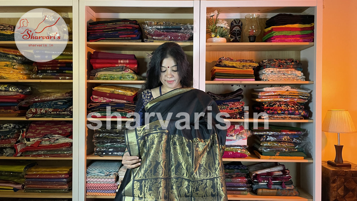 Handwoven Black Semi Raw Silk Saree with Tribal Art Threadwork Patterns