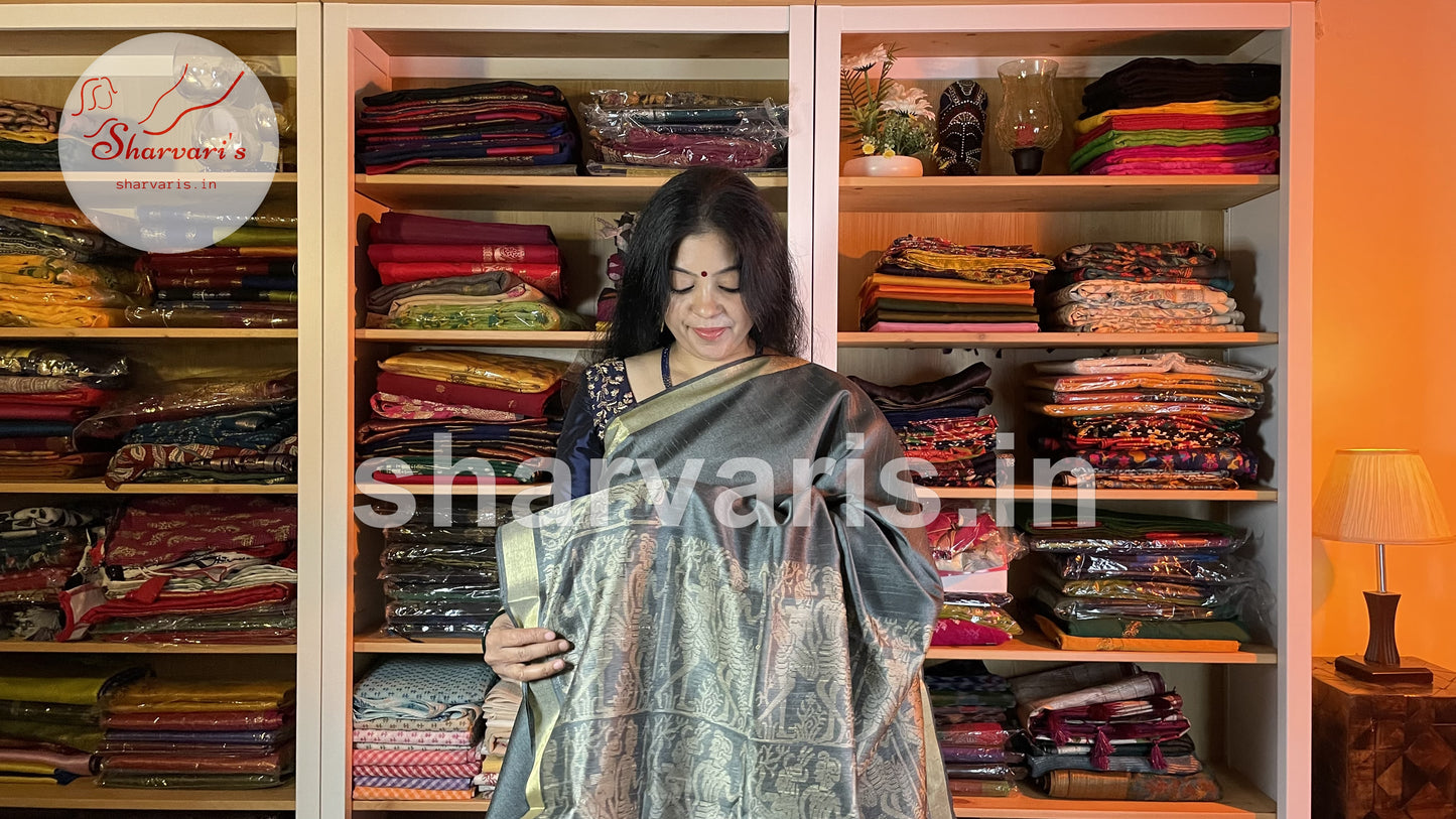 Handwoven Slate Grey Semi Raw Silk Saree with Tribal Art Threadwork Patterns