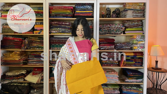 Rani Pink and Mustard Yellow Blended Cotton Dress Material with Ikkat Print Dupatta