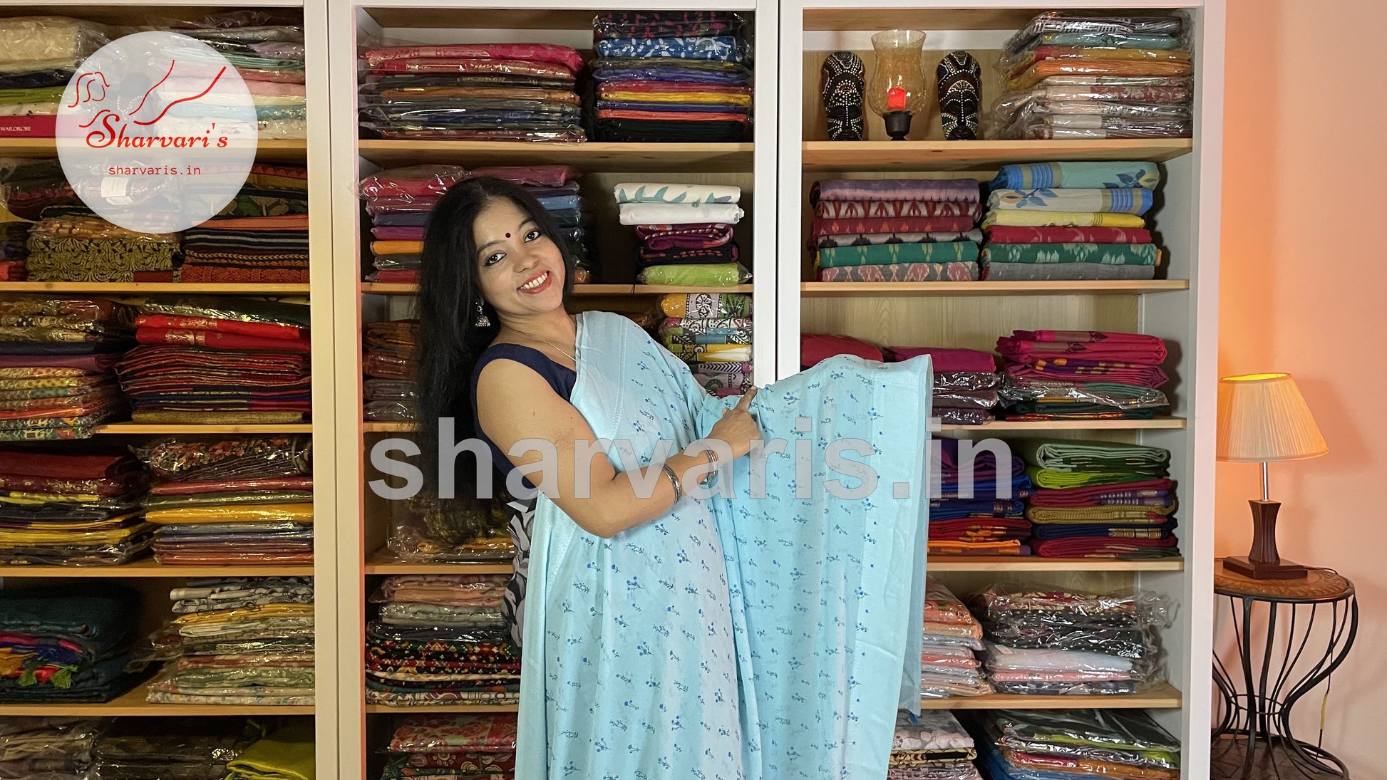 sky blue smooth chiffon saree with small floral prints