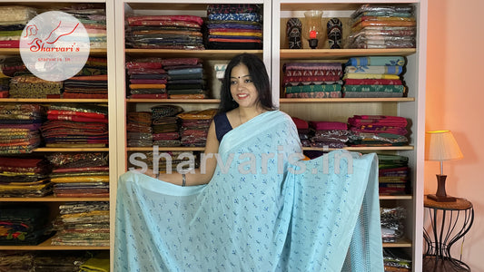 sky blue smooth chiffon saree with small floral prints