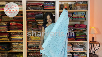 sky blue smooth chiffon saree with small floral prints