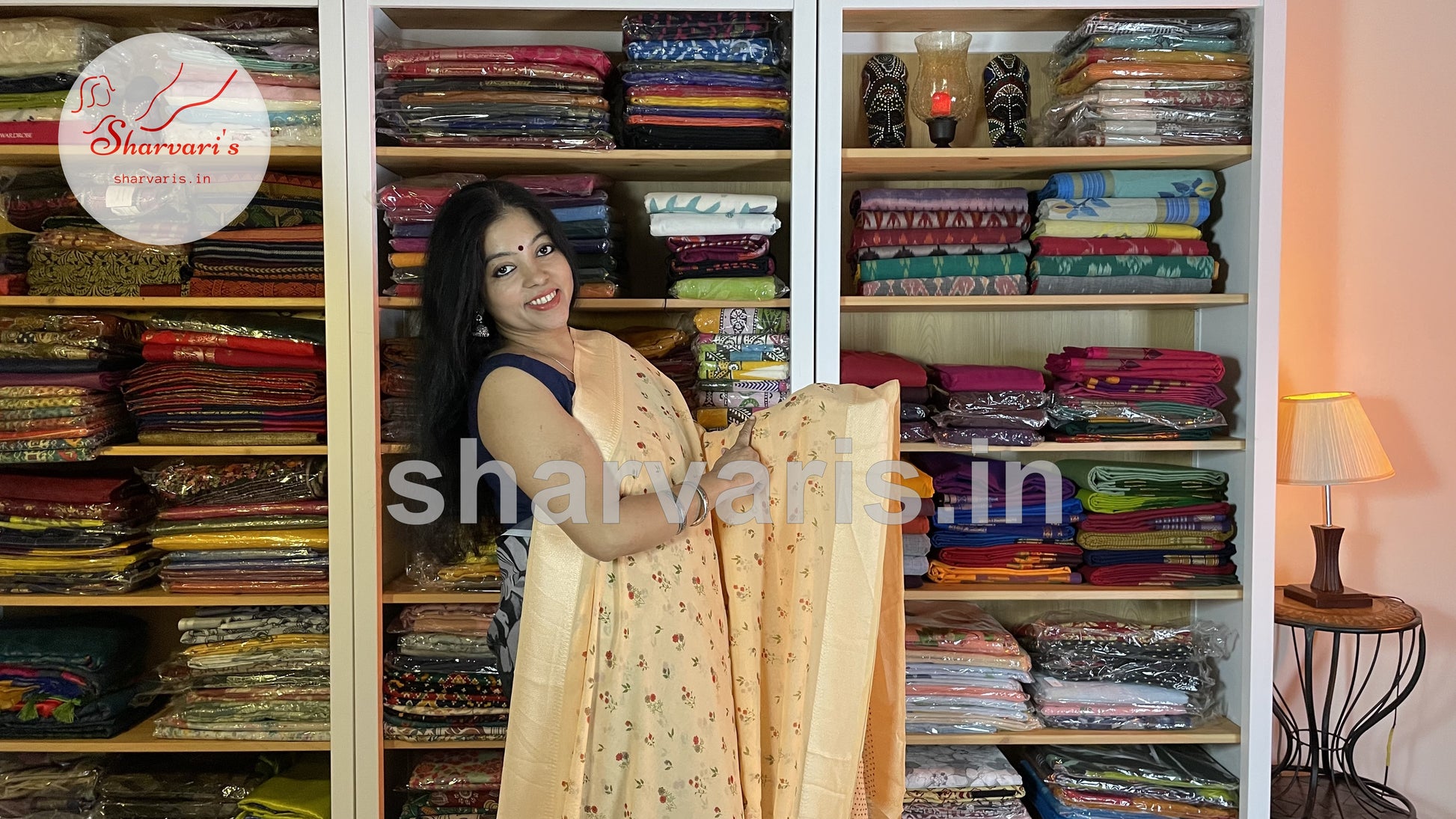 peach smooth chiffon saree with small floral prints 