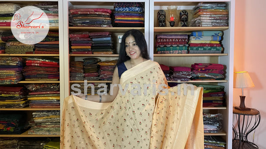 peach smooth chiffon saree with small floral prints