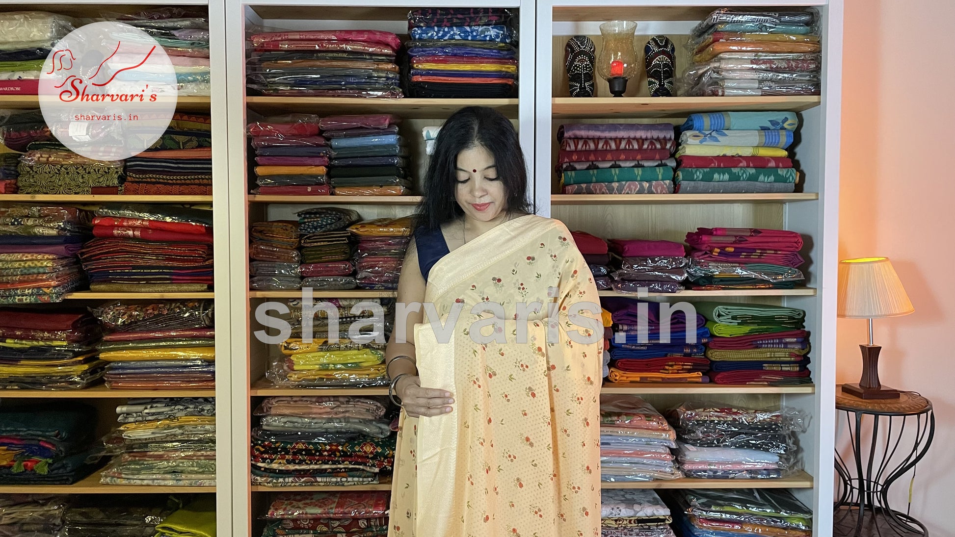 peach smooth chiffon saree with small floral prints