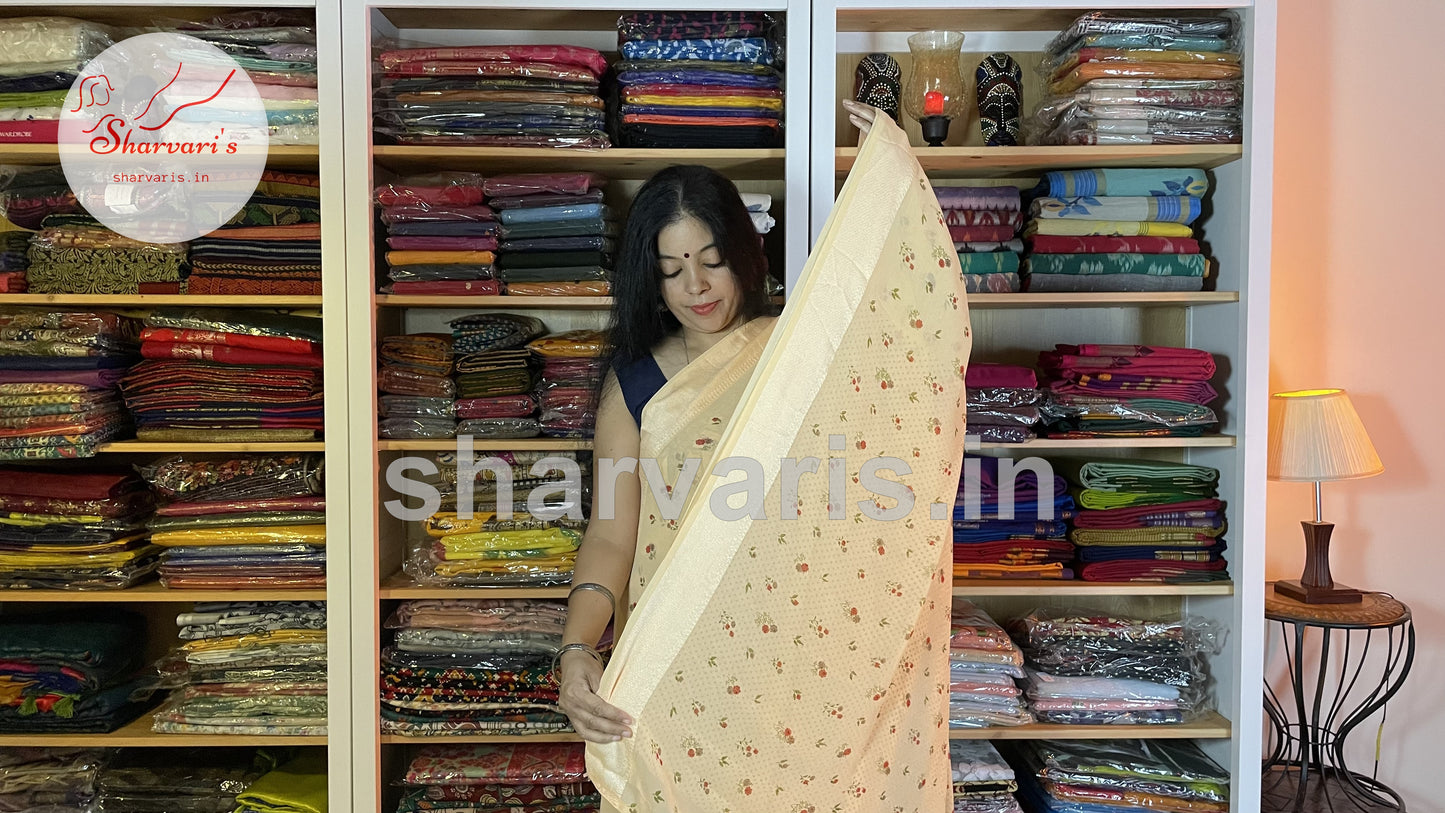 peach smooth chiffon saree with small floral prints 