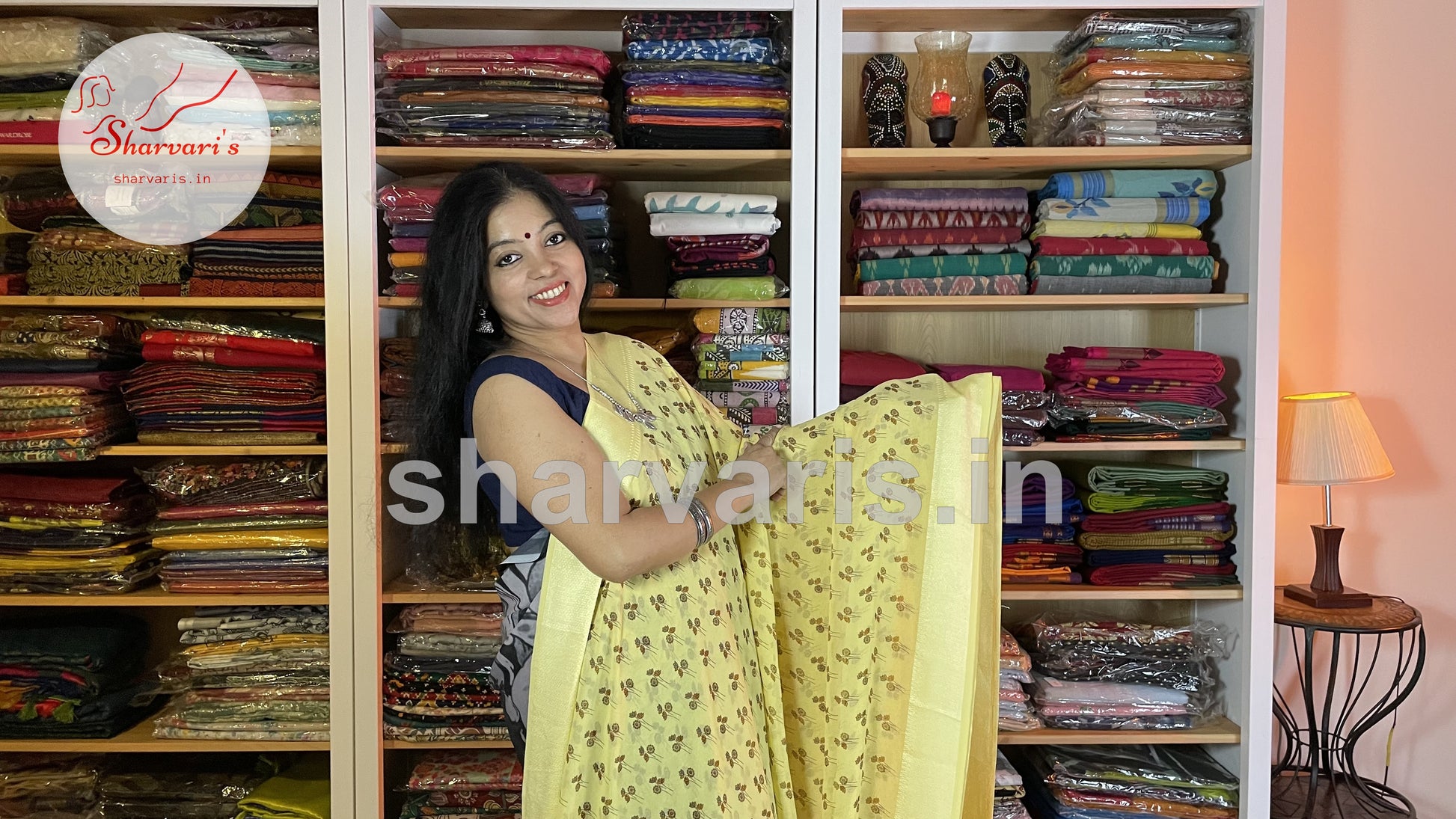 lemon yellow smooth chiffon saree with floral prints