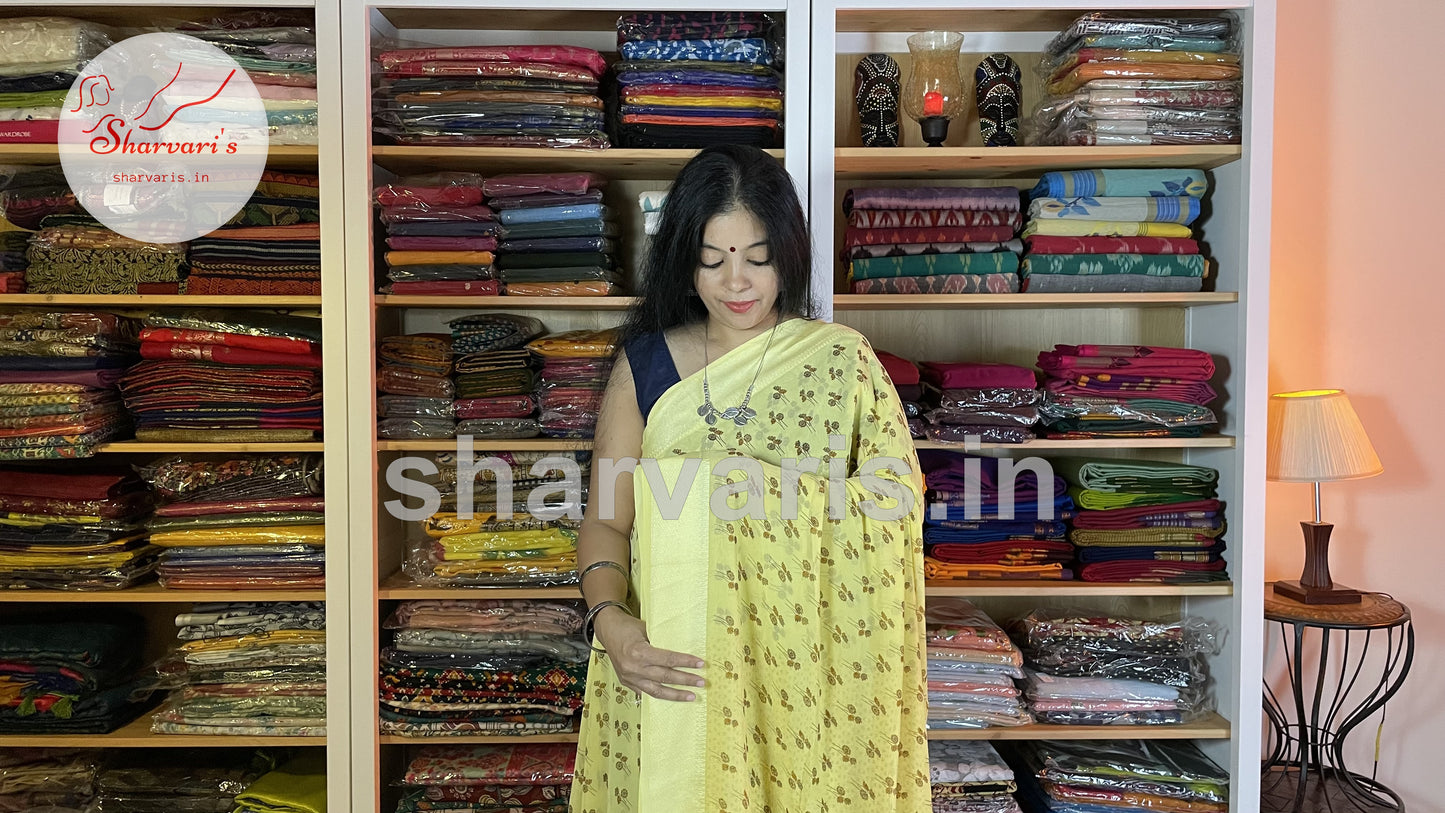 lemon yellow smooth chiffon saree with floral prints 