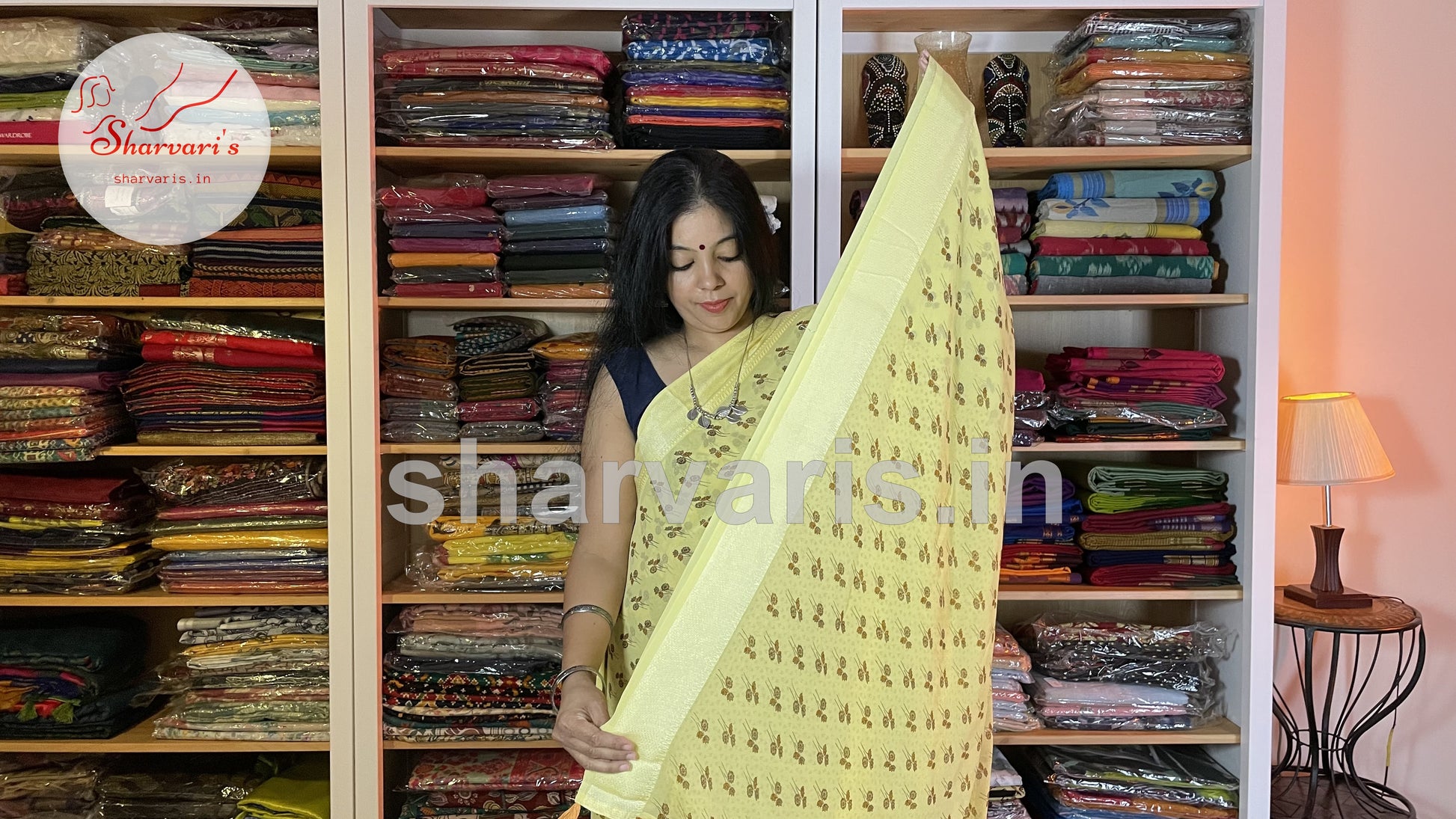 lemon yellow smooth chiffon saree with floral prints